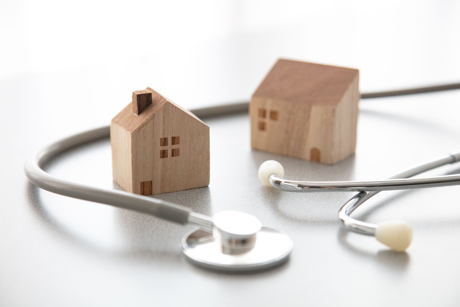 Miniature house and Medical stethoscope